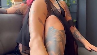 Aroused Young Woman With Tattoos Exhibiting Her Physique